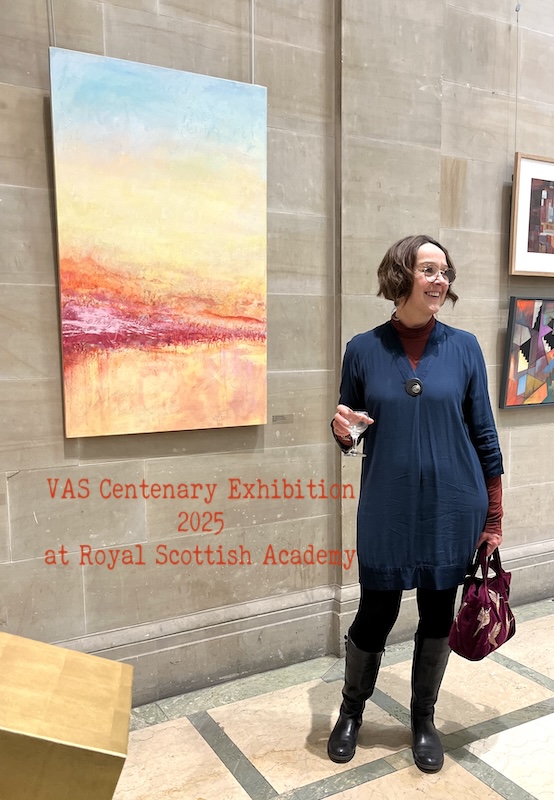 artist with painting at exhibition